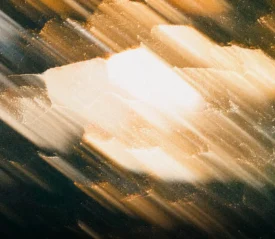 Abstract golden and white streaks of light symbolize God’s power to restore life and bring hope to broken things, reflecting healing, renewal, and spiritual victory.