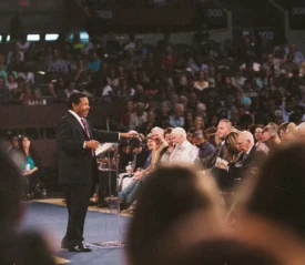 Minister speaking to an audience at Southwest Believers' Convention