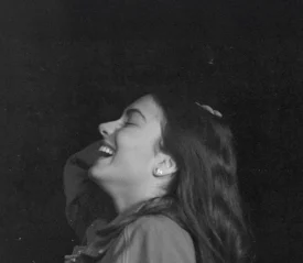 black and white photo of girl laughing