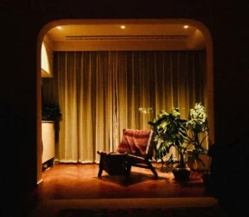 empty chair in a lit dimly room