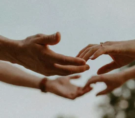 man and woman holding hands