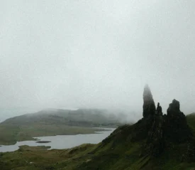 foggy field and a lake