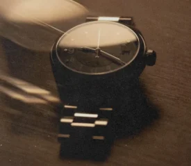 Minimalist wristwatch on a wooden surface symbolizing time management as a faith exercise, encouraging intentional daily habits that strengthen spiritual growth.