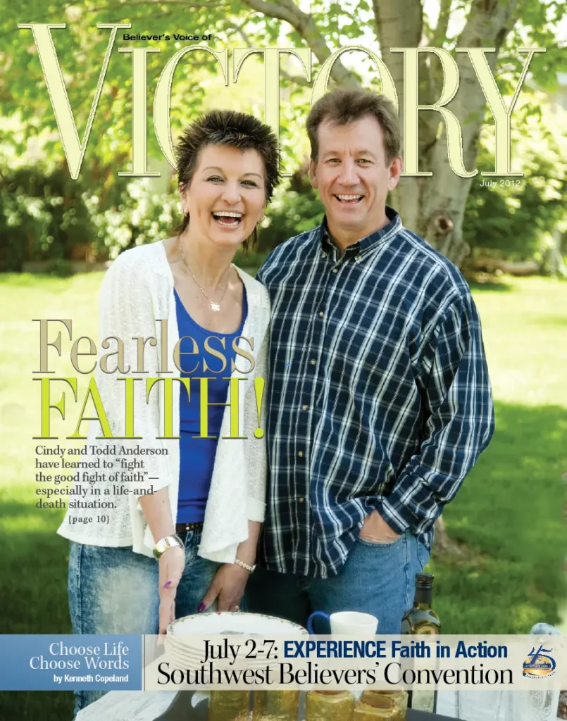 A magazine cover titled “VICTORY” featuring two individuals standing outdoors in a grassy park setting with the headline “Fearless Faith.”