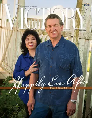 A magazine cover titled “VICTORY” featuring two individuals standing outdoors beside a white fence with the headline “Happily Ever After.”