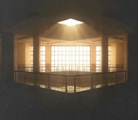 Sunlight streaming through a large skylight and grid-patterned windows, illuminating the upper level of a spacious interior with railings and supporting columns