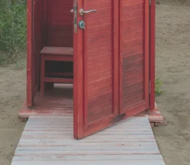 An open door to a small hut on the beach