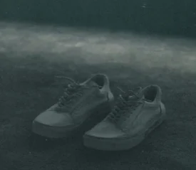 A pair of empty shoes on the ground