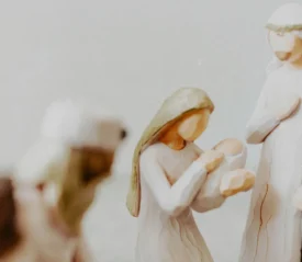 Wooden Mary and Joseph holding baby Jesus figurine