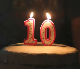 "10" candle lit on a cake