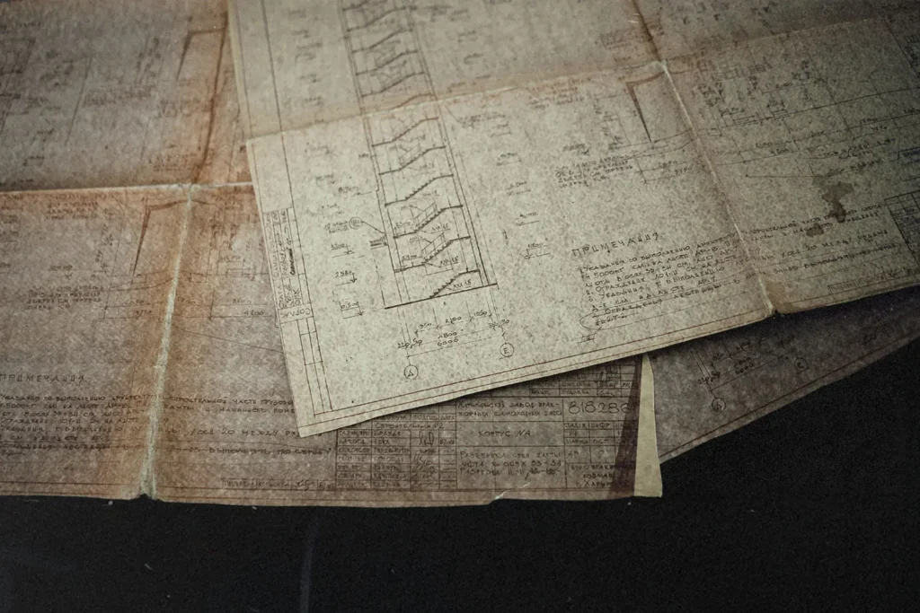 Table filled with papers of blueprints