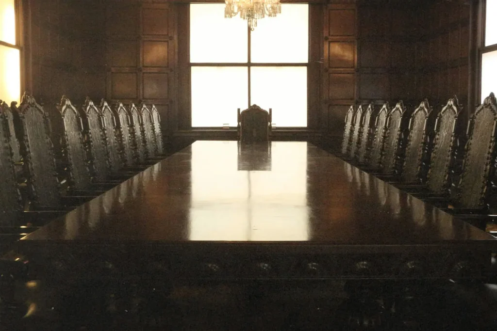 Board room with empty table and chairs