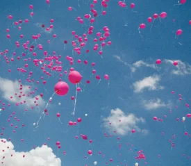 Sky full of pink balloons