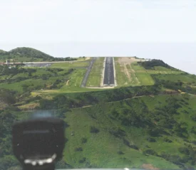 Landing strip in a mountain surrounded by greenery