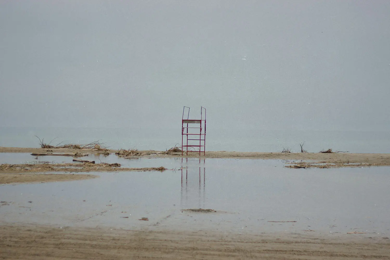Metal scaffolding in the middle of sandy shore