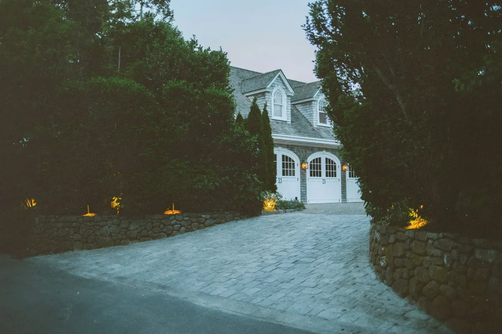 Driveway with trees leading to a garage