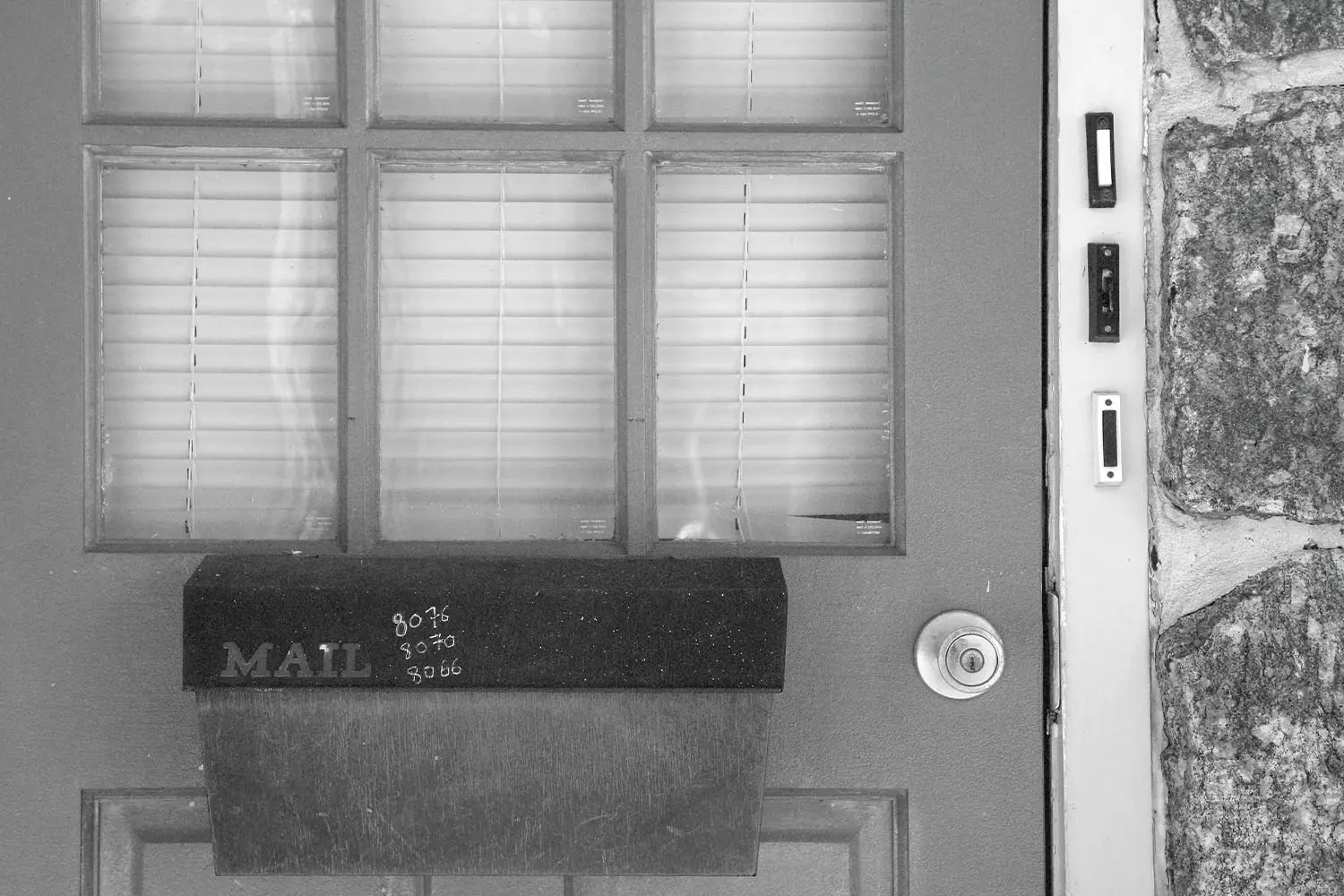 Mail box on the front door with doorbell