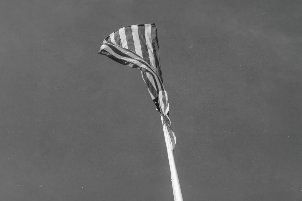 black and white image of usa flag in the sky