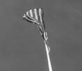 black and white image of usa flag in the sky
