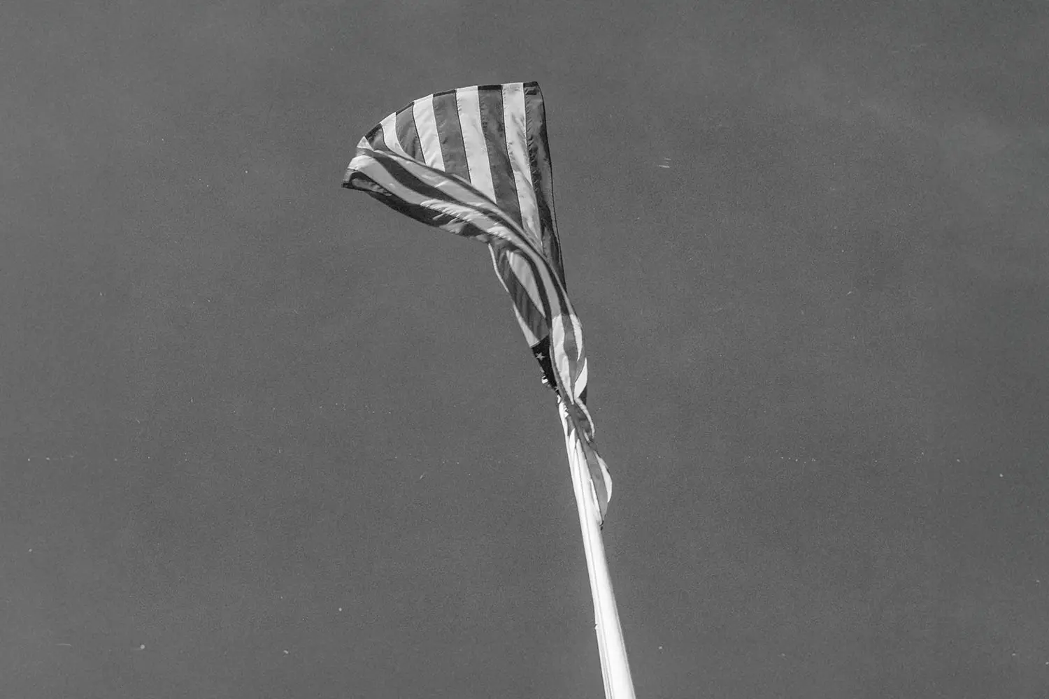 black and white image of usa flag in the sky