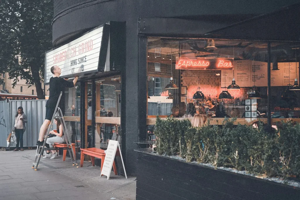 Street-view of cafe store window and theatre sign