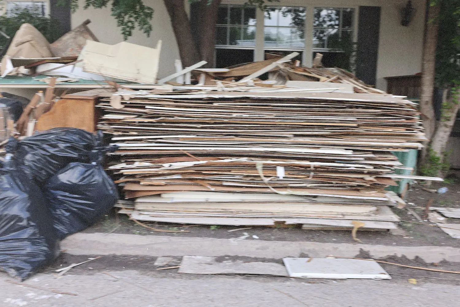 stack of damaged wall panels
