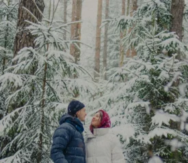 Couple standing in the snow