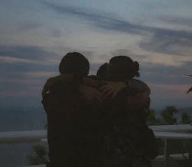 Group of people hugging each other