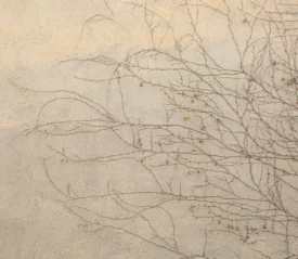 dead vines crawling up a stone wall