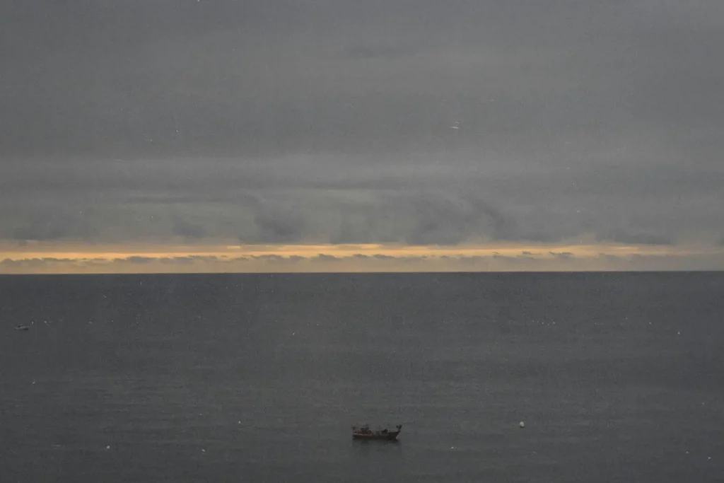 Single boat in the middle of the ocean