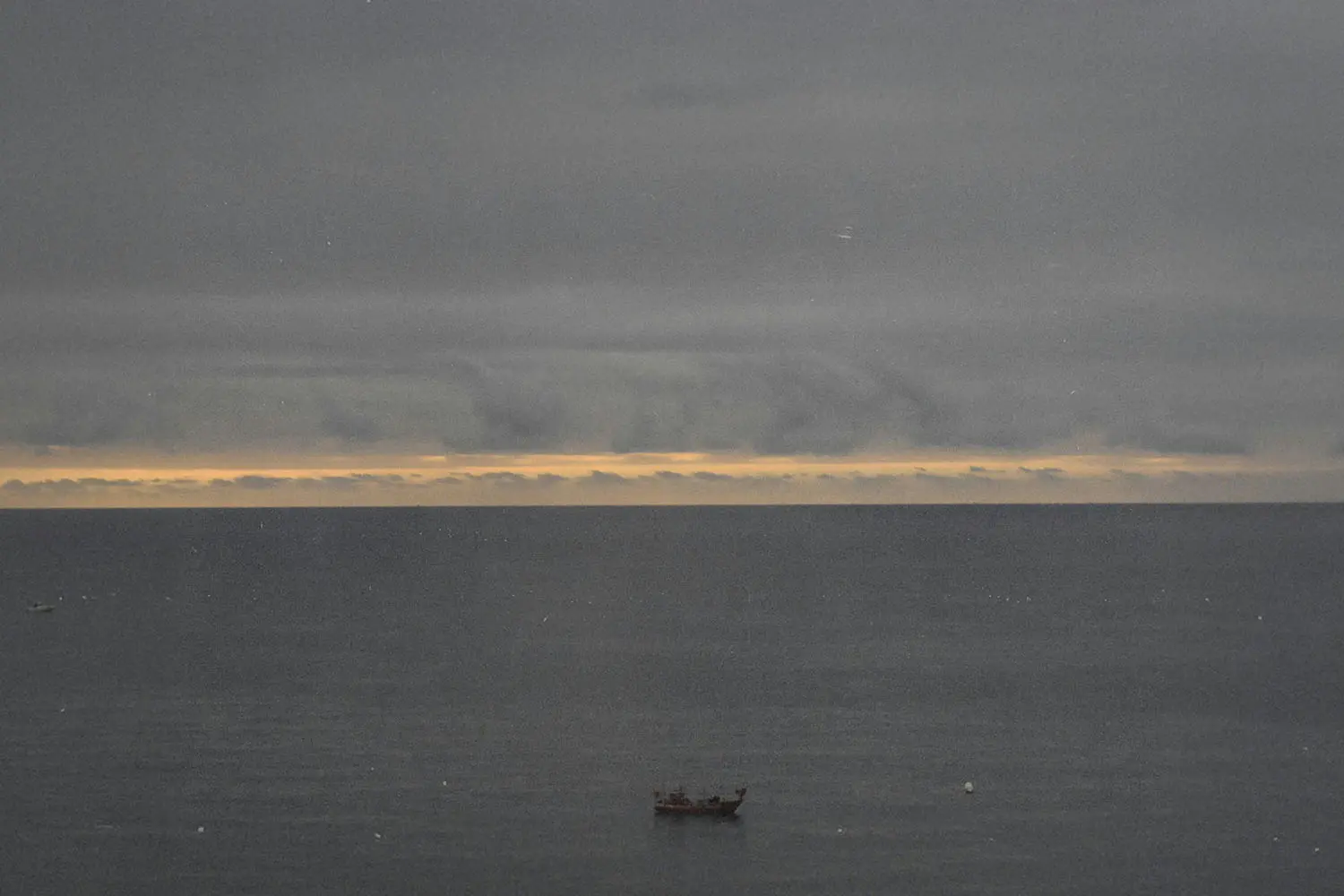 Single boat in the middle of the ocean