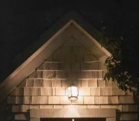 house with light on above the door