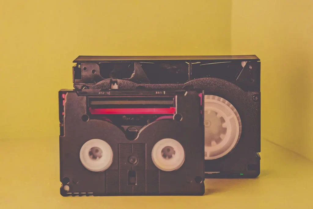 Cassette tape in front of a recorder