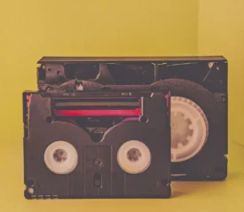 Cassette tape in front of a recorder