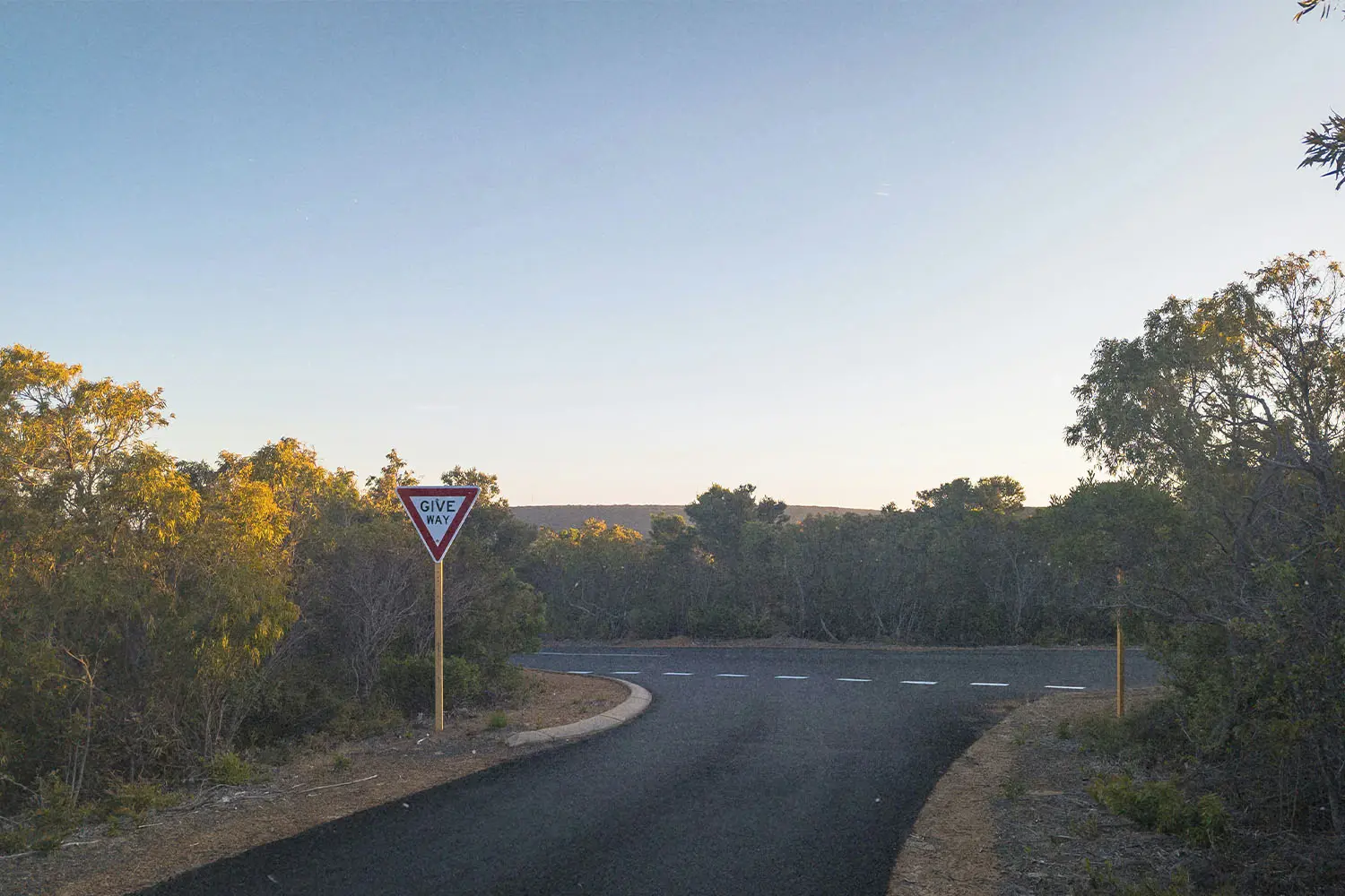 Empty road with a yield sign