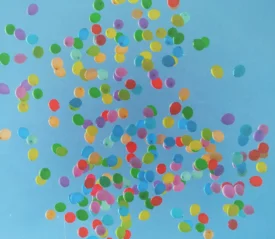 many colored balloons set free in the sky