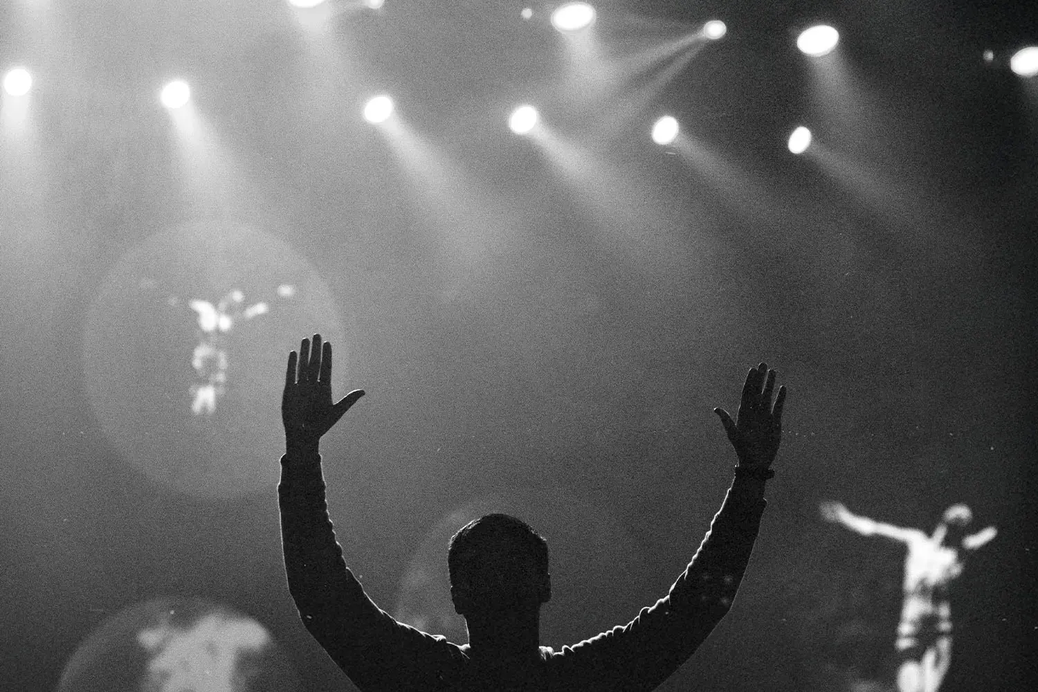 man worshipping Jesus with raised hands