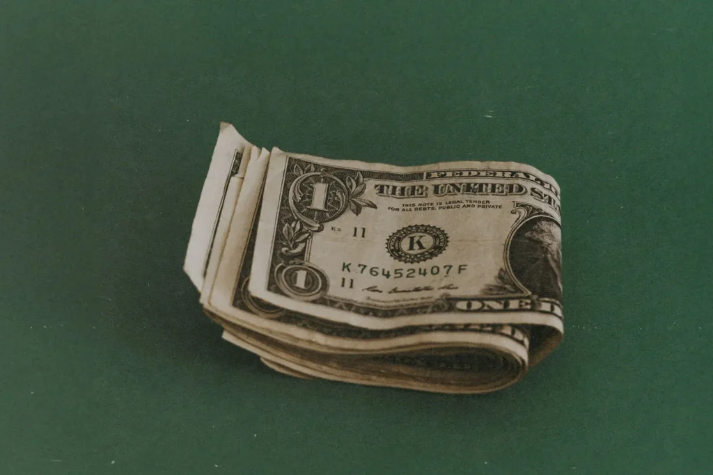 single dollar bills folded together