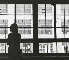 Woman looking out loft window