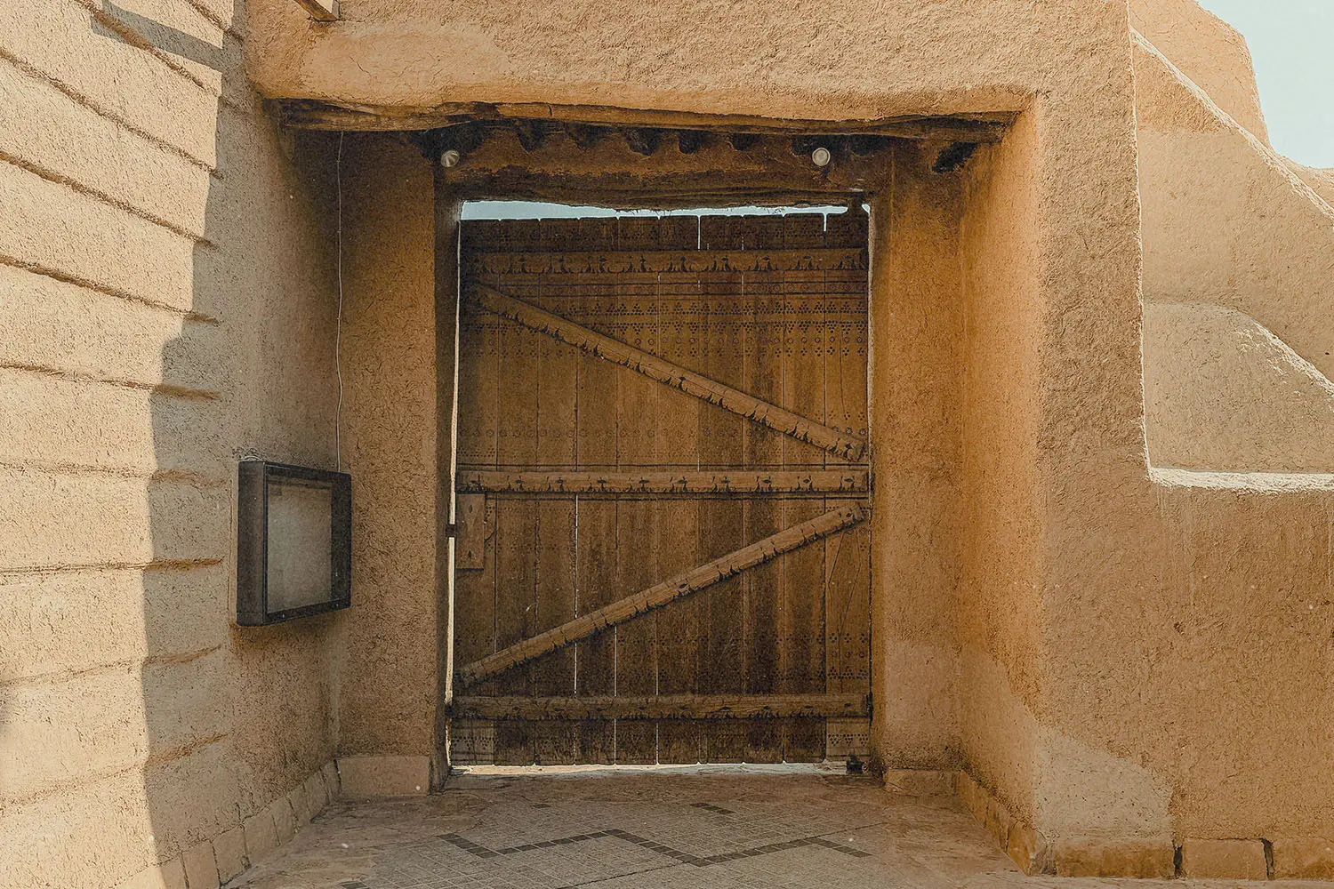 Entryway with a wooden door