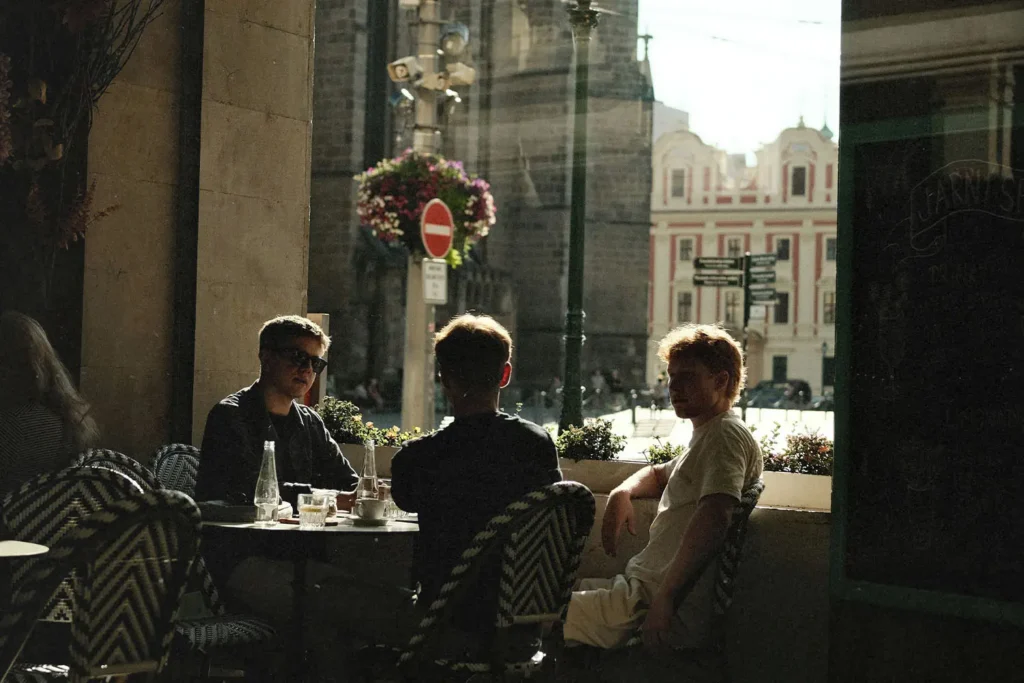 Group of men sitting at outdoor cafe
