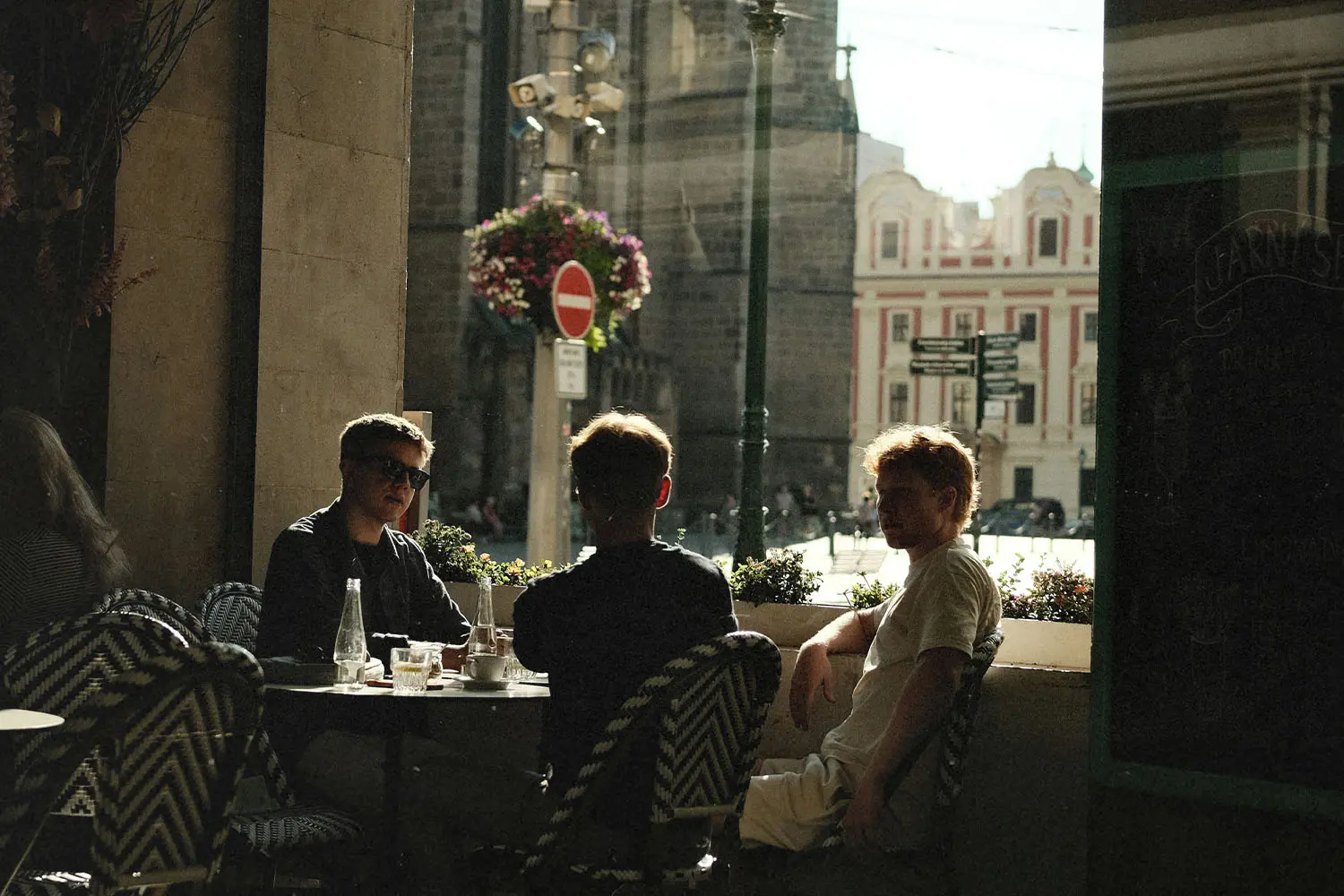 Group of men sitting at outdoor cafe