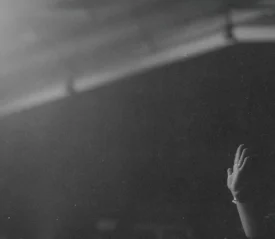 Single hand lifted in praise