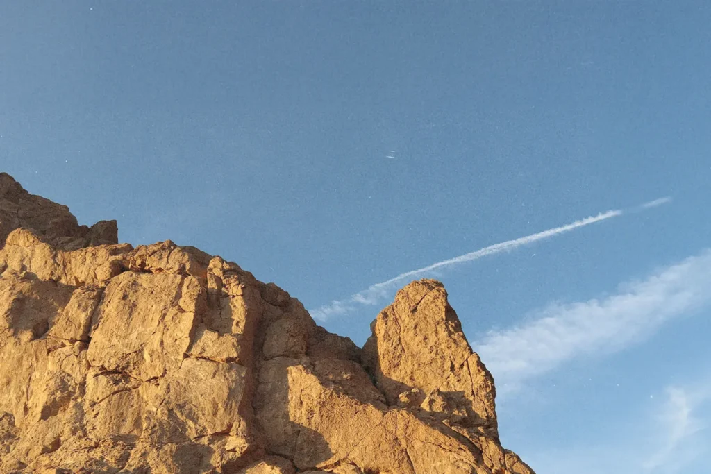 Rocky mountain top with clear blue sky in the background