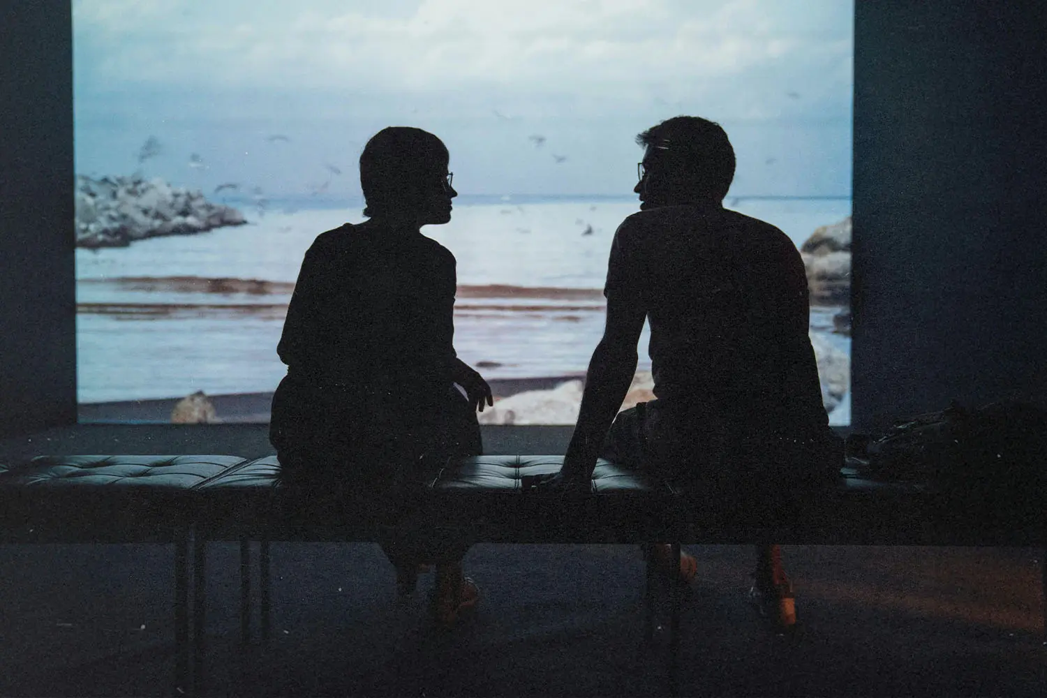 Two people talking on a patio