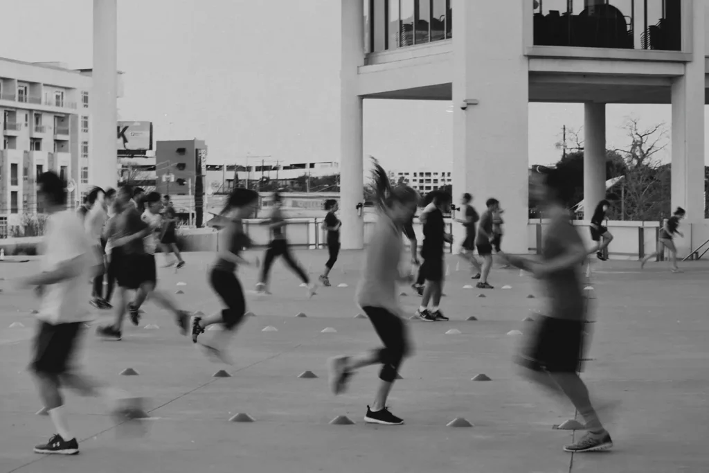 Group of athletes running drills