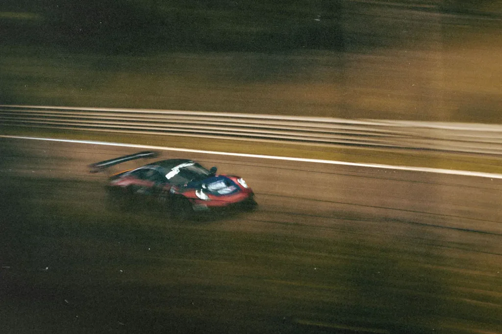 Race car speeding down open road