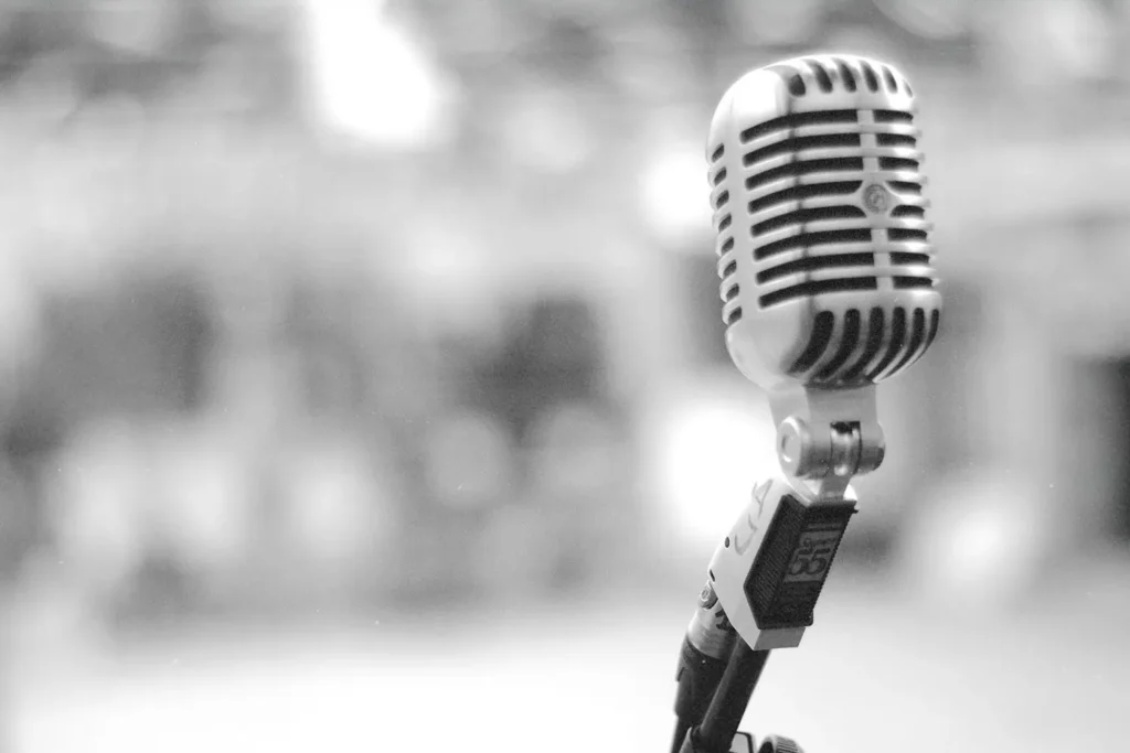 Vintage-style microphone on a stand with a blurred background
