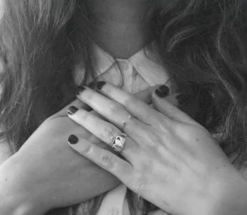 Two hands grasping sternum