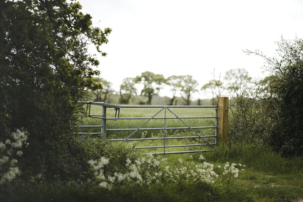 Closed gate to open land
